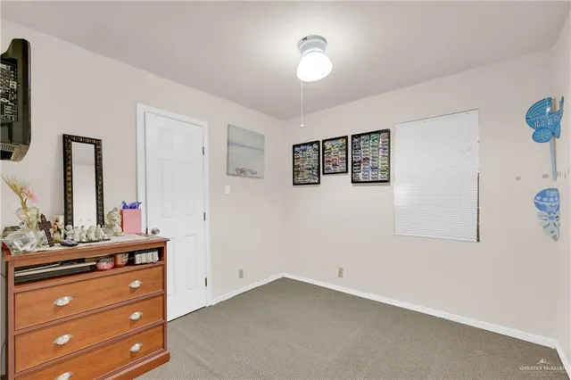 a room with a dresser and a mirror