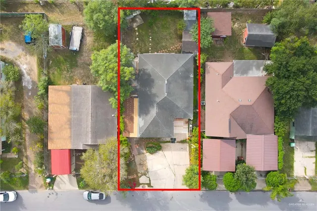 an aerial view of houses with yard