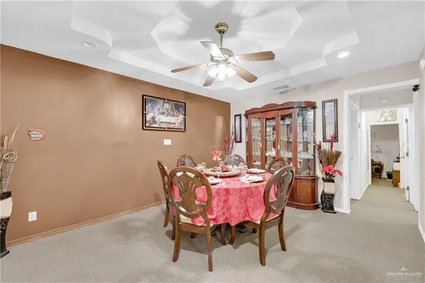 a dining room with furniture and window