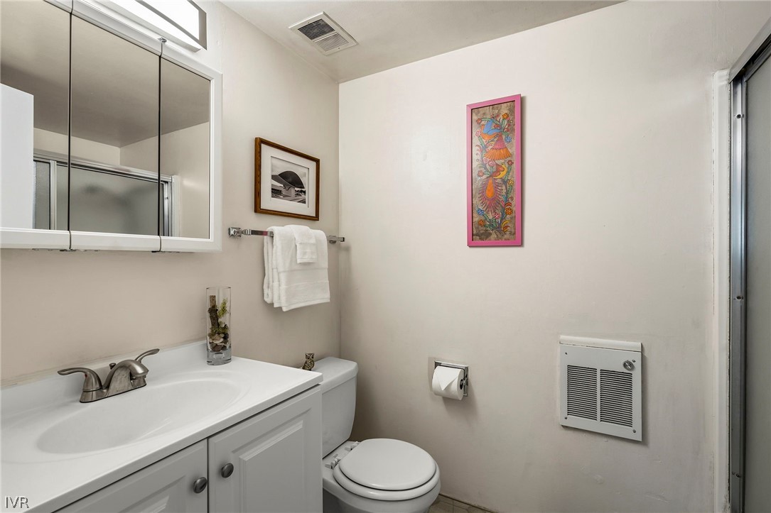 321 Ski Way, Unit 137 Incline Village, NV 89451 - Photo 19 of 21 a bathroom with a toilet a sink and mirror