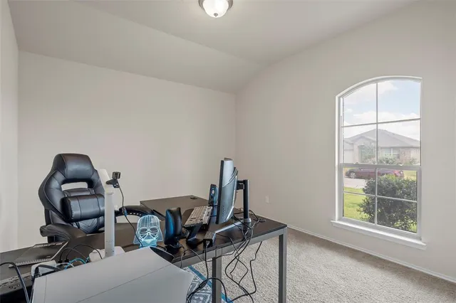 a view of a workspace with furniture