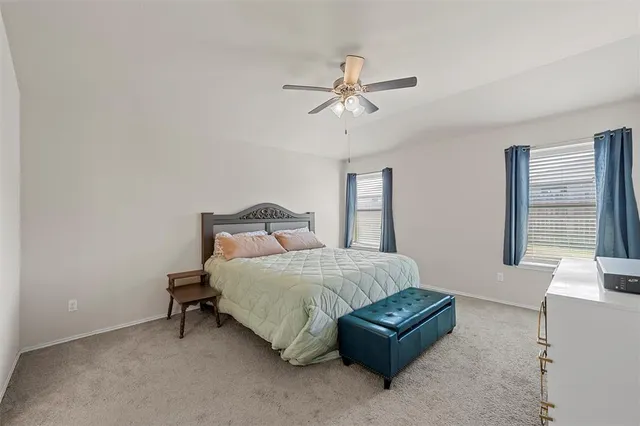 a bathroom with a sink mirror and vanity