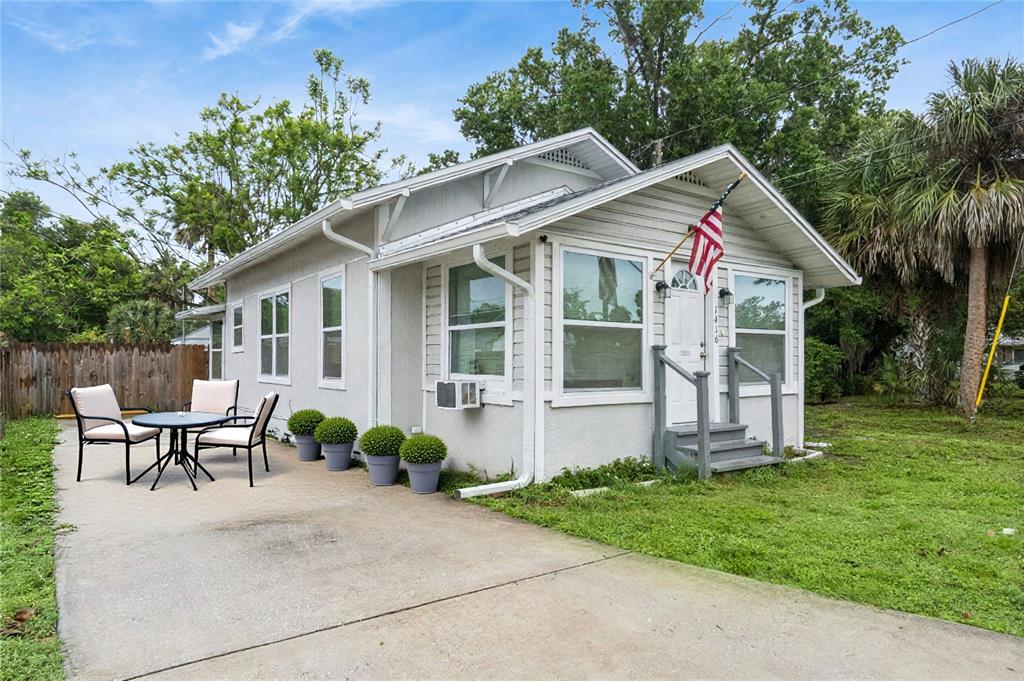 1416 6th Street St. Cloud, FL 34769 - Photo 1 of 13 a front view of a house with porch
