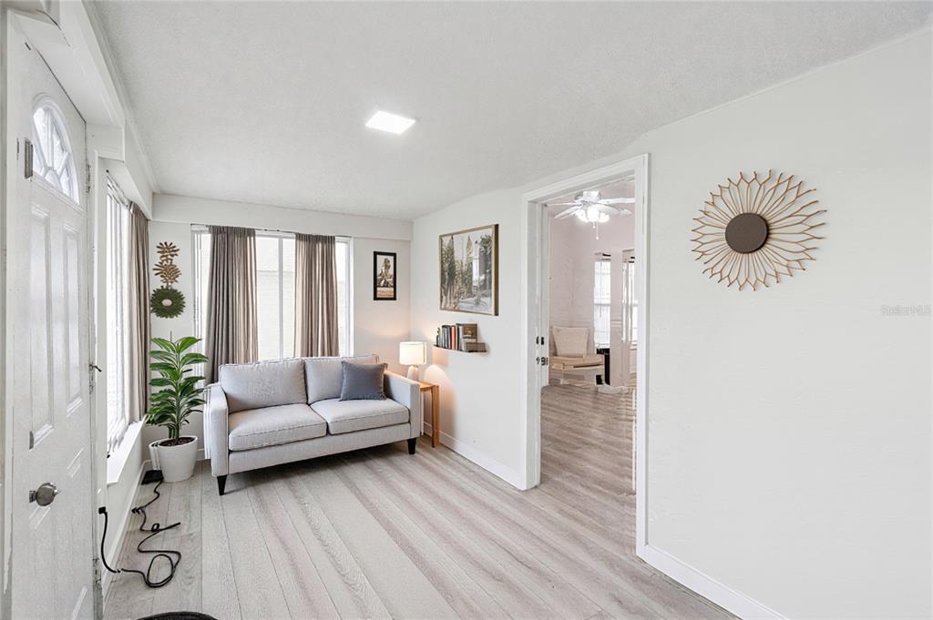 1416 6th Street St. Cloud, FL 34769 - Photo 4 of 13 a living room with furniture and a wooden floor