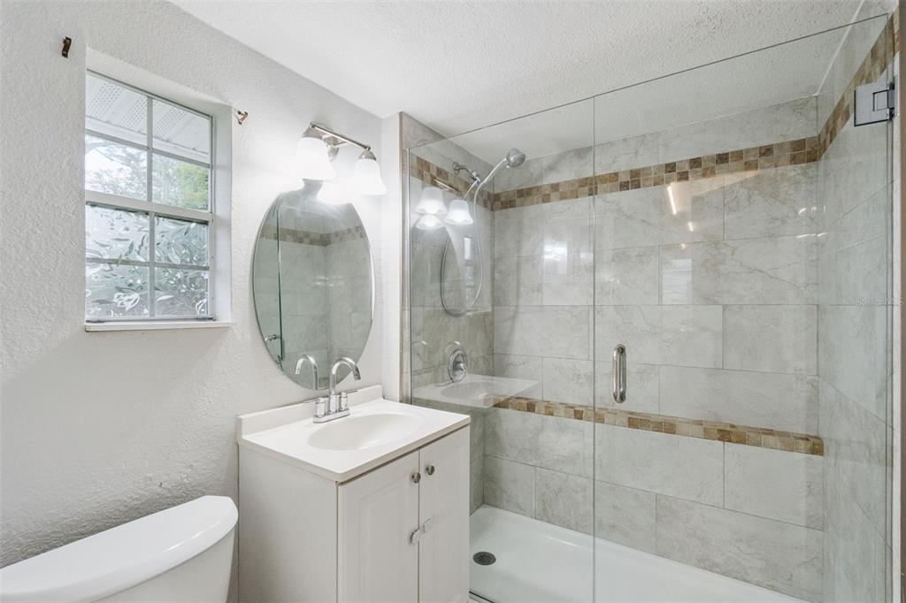 1416 6th Street St. Cloud, FL 34769 - Photo 10 of 13 a bathroom with a sink toilet and shower