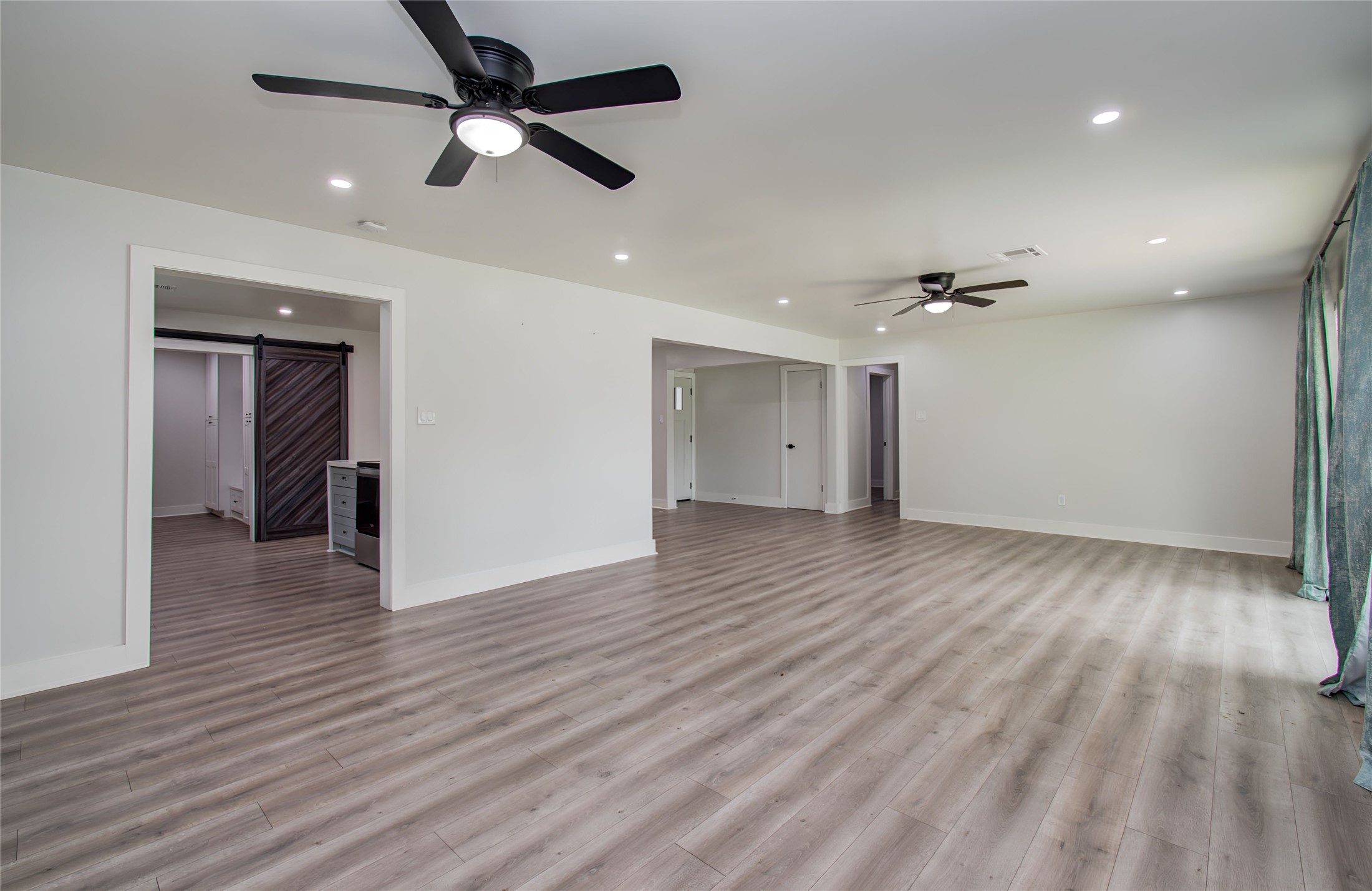 10415 Westray Street Houston, TX 77043 - Photo 25 of 45 a view of an empty room with wooden floor