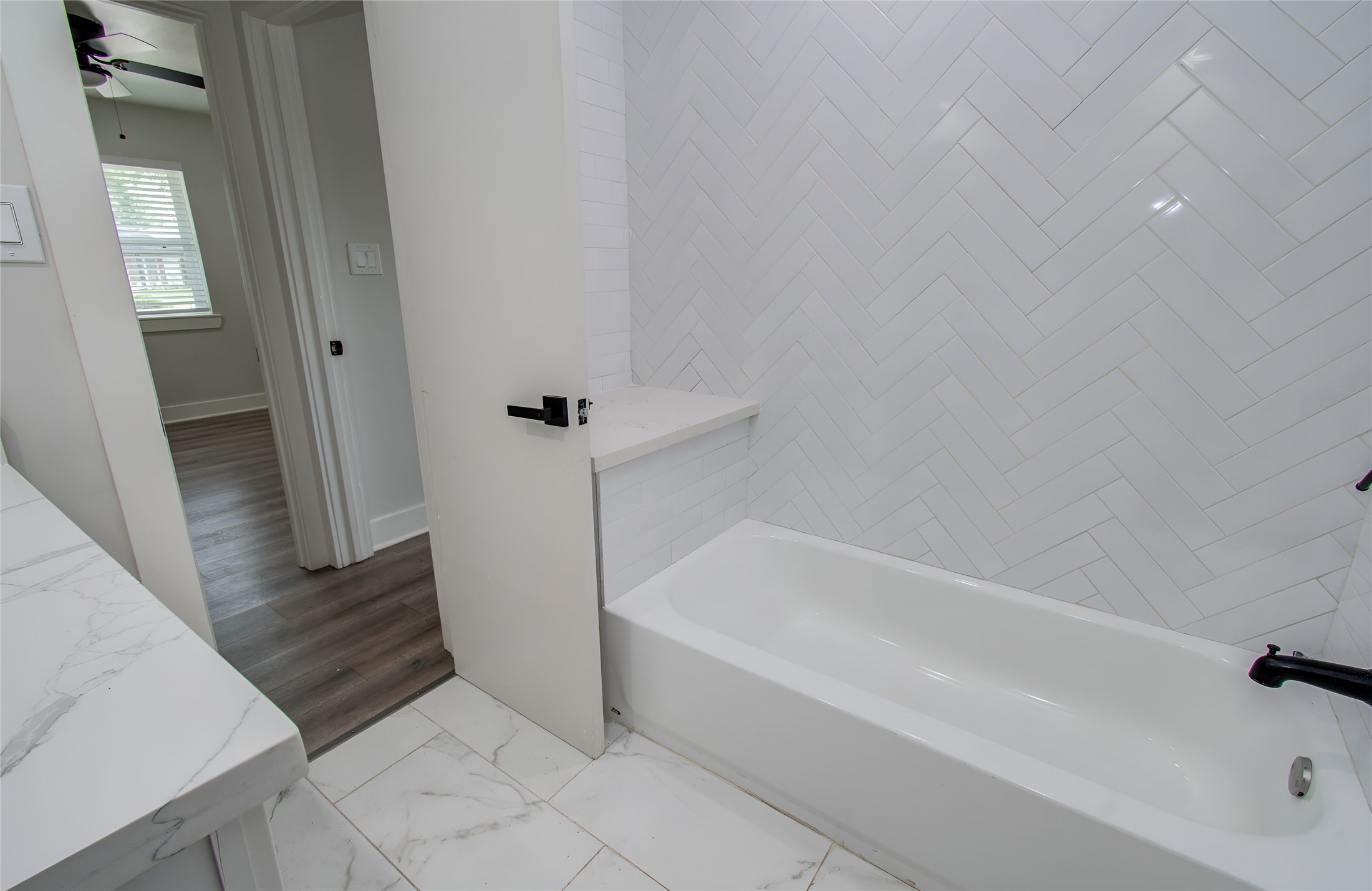 10415 Westray Street Houston, TX 77043 - Photo 34 of 45 a bathroom with bathtub and shower