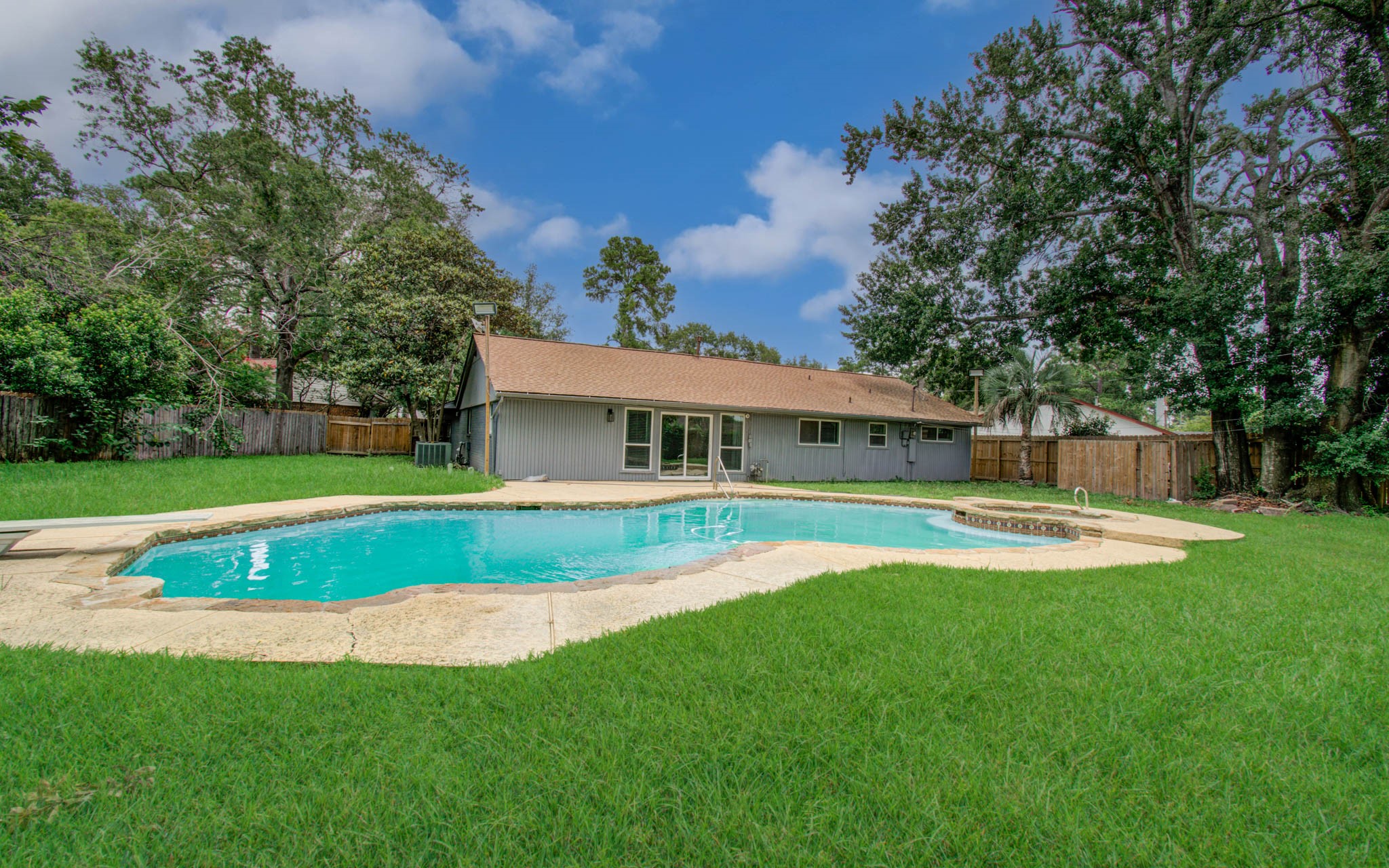 10415 Westray Street Houston, TX 77043 - Photo 44 of 45 a view of a house with a big yard