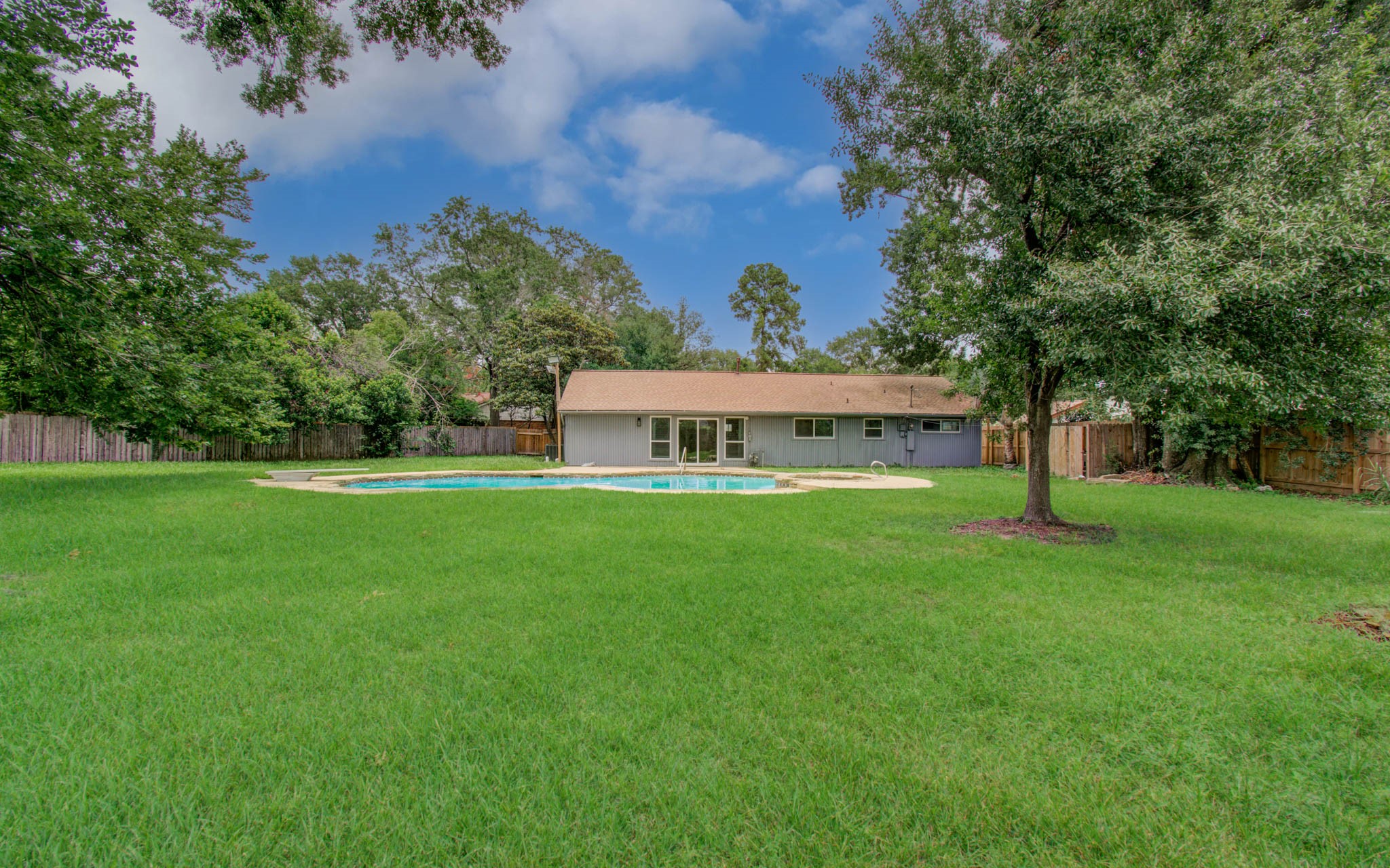 10415 Westray Street Houston, TX 77043 - Photo 45 of 45 a view of a house with a yard