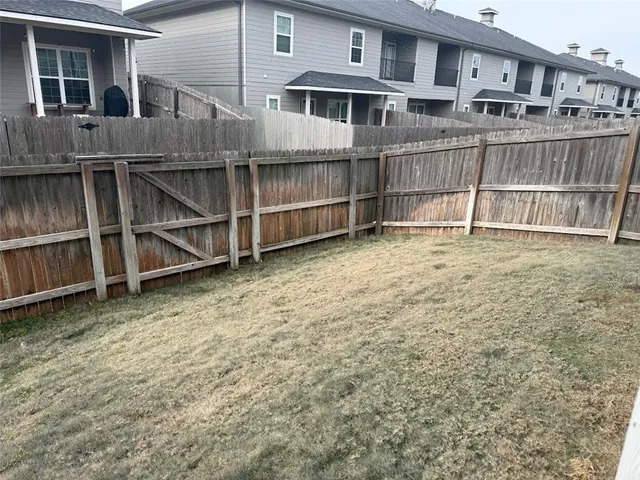 a view of a house with wooden floor in front of a house