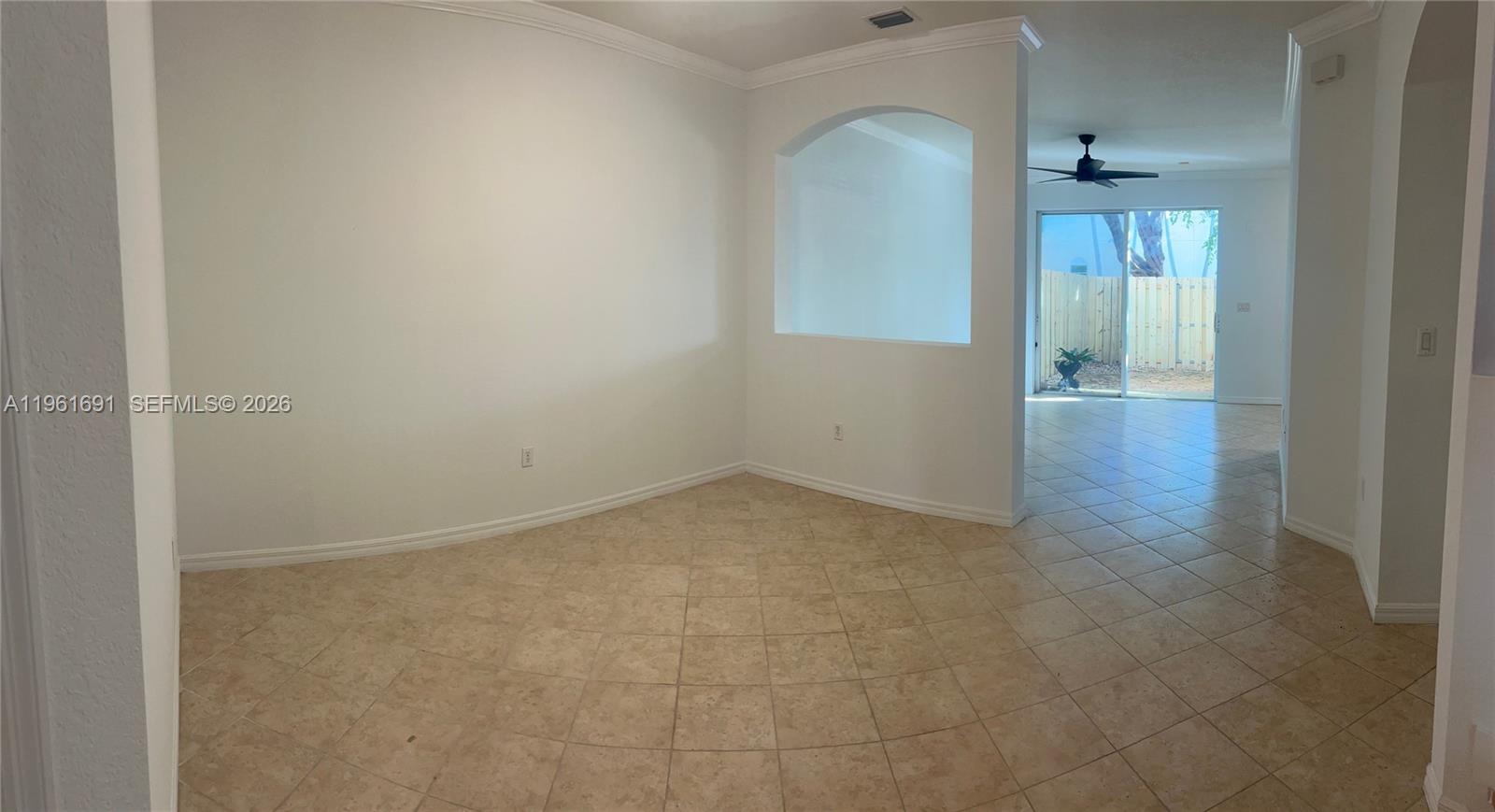 12458 Southwest 125th Terrace, Unit 12458 Miami, FL 33186 - Photo 8 of 22 a view of a room with an empty space