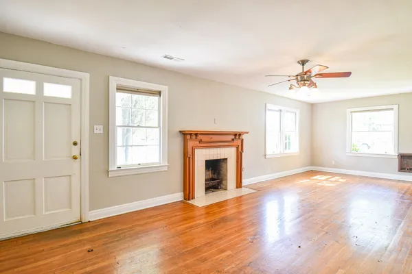 a view of an empty room with a fireplace
