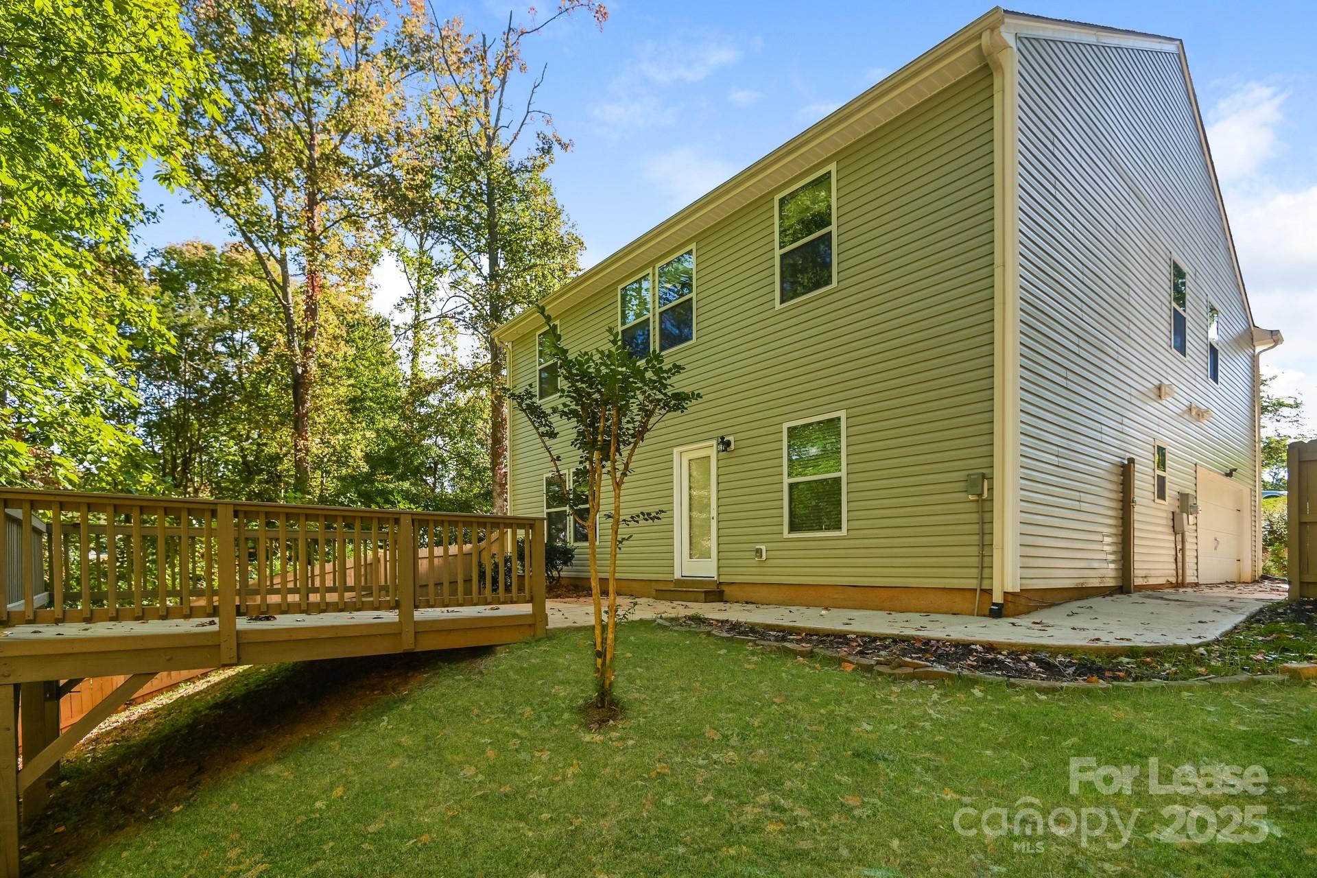 10813 Flintshire Road Mint Hill, NC 28227 - Photo 15 of 17 a view of a house with a yard