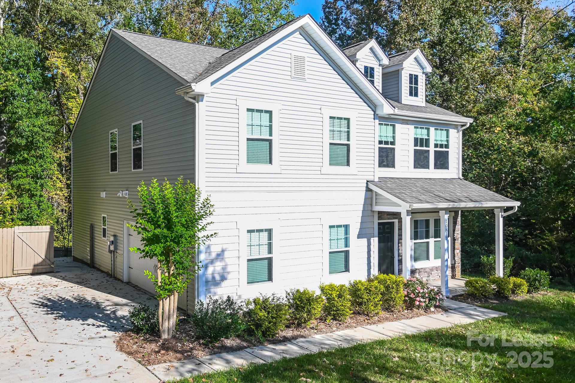 10813 Flintshire Road Mint Hill, NC 28227 - Photo 2 of 17 a front view of a house with garden