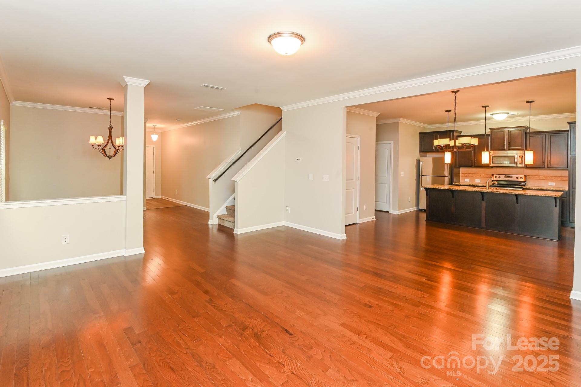 10813 Flintshire Road Mint Hill, NC 28227 - Photo 4 of 17 a view of a living room with wooden floor