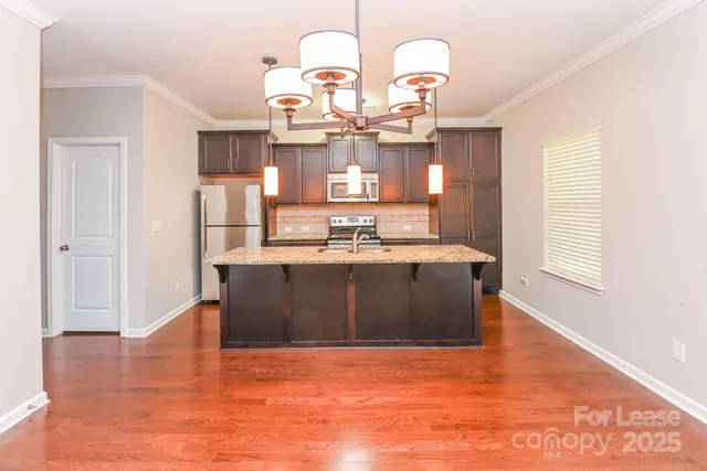 a living room with hard wood flooring