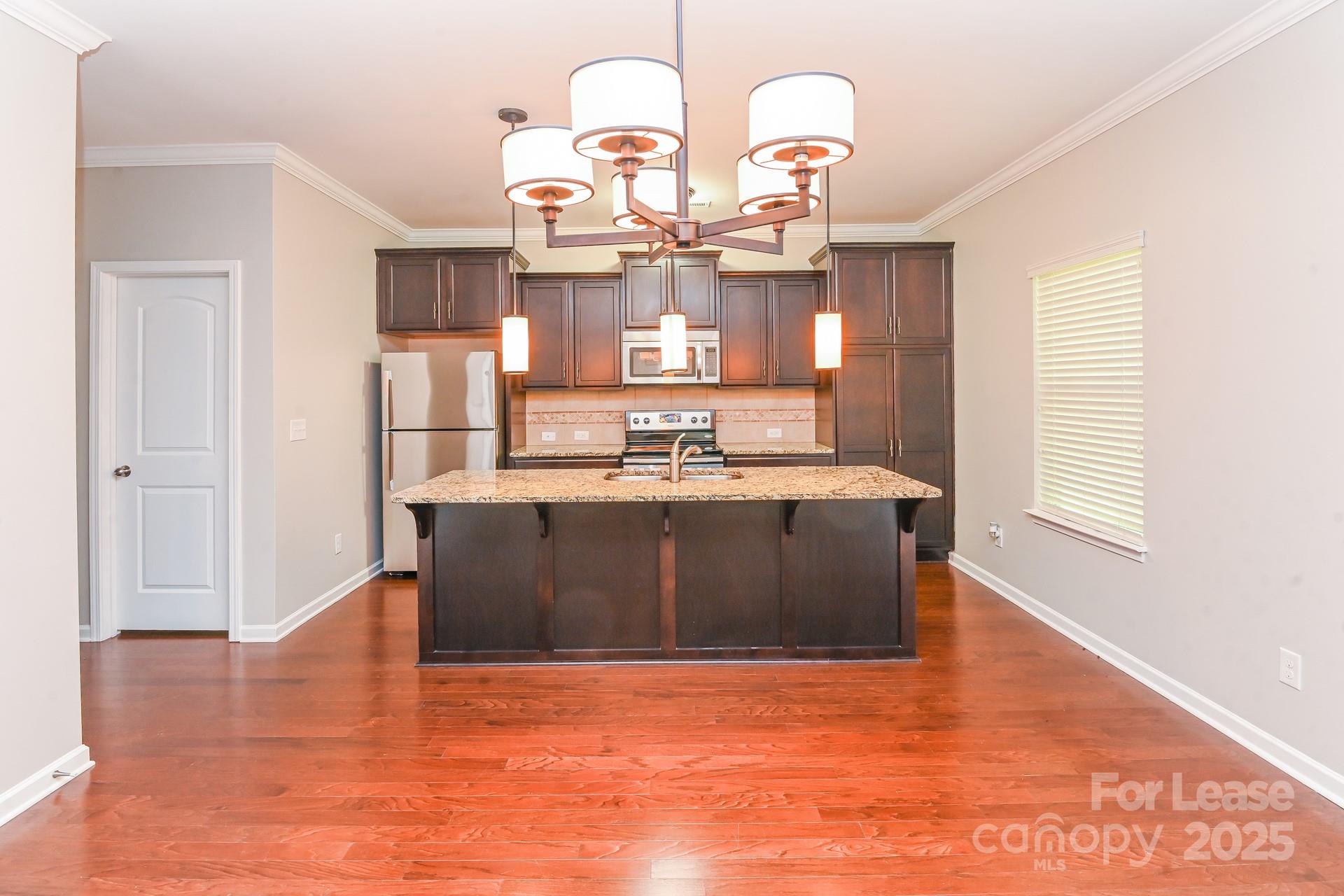 10813 Flintshire Road Mint Hill, NC 28227 - Photo 8 of 17 a living room with hard wood flooring