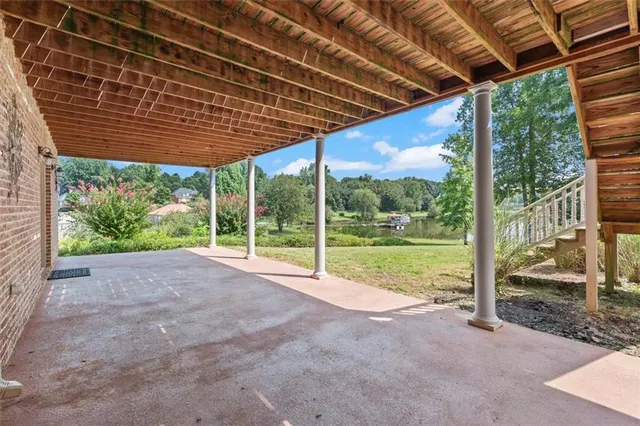 a view of a livingroom with furniture and natural light