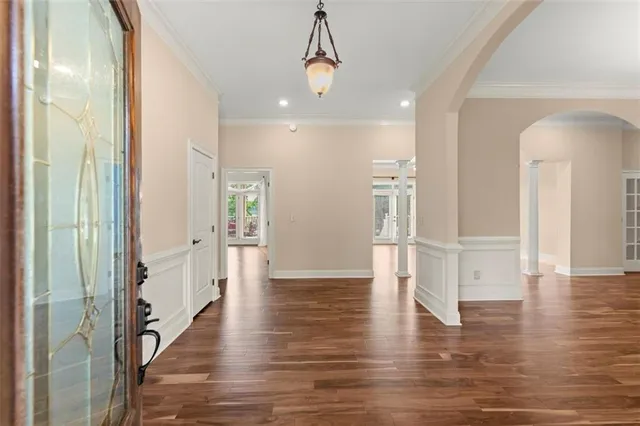 a view of a room with a ceiling fan and a window