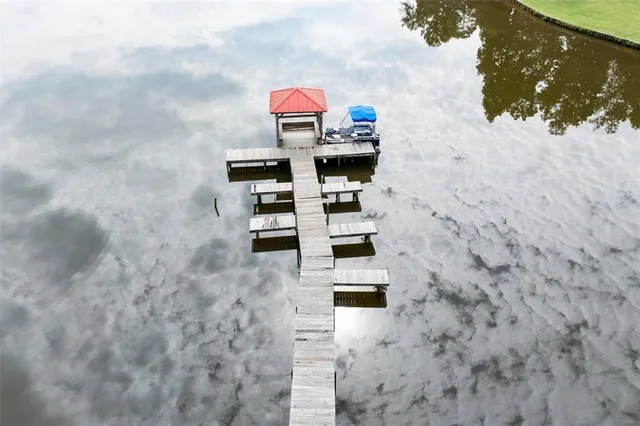 a view of a wooden chairs in a balcony