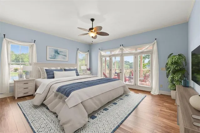 an empty room with ceiling fan and window