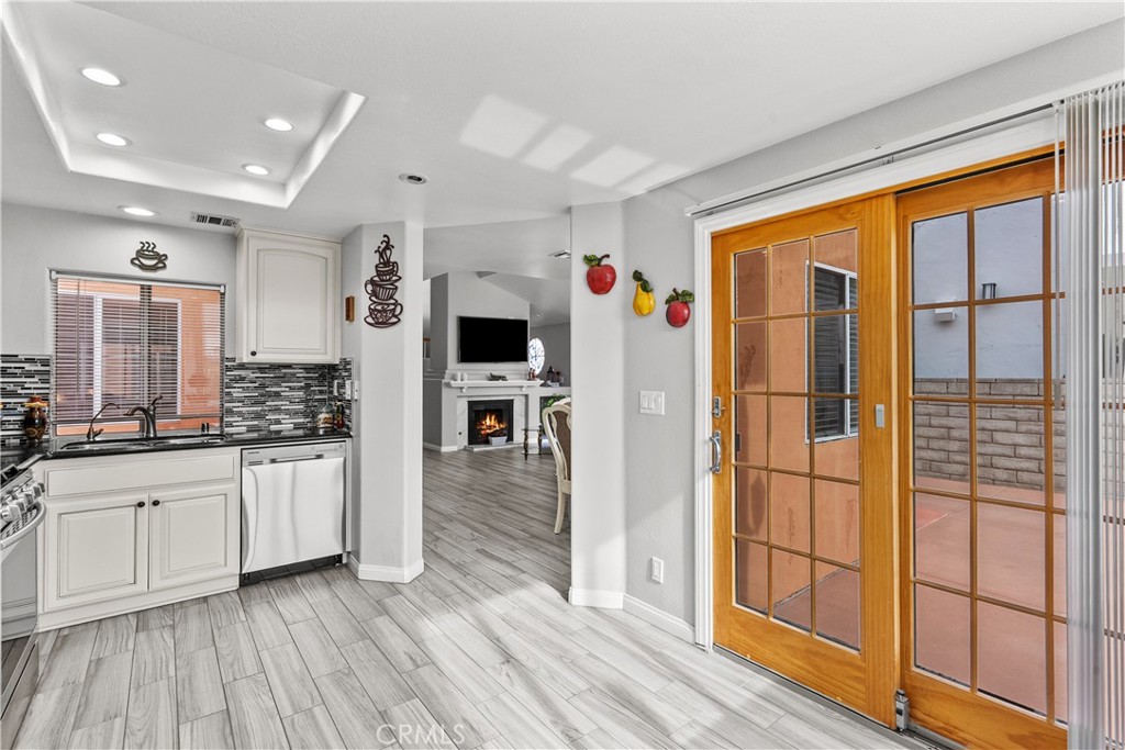 25726 Emerson Lane Stevenson Ranch, CA 91381 - Photo 15 of 45 a kitchen with stainless steel appliances granite countertop a refrigerator and a sink