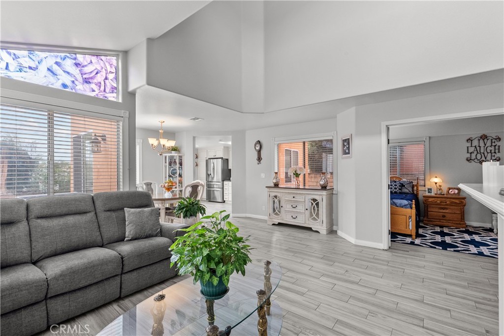 25726 Emerson Lane Stevenson Ranch, CA 91381 - Photo 16 of 45 a living room with furniture and a wooden floor