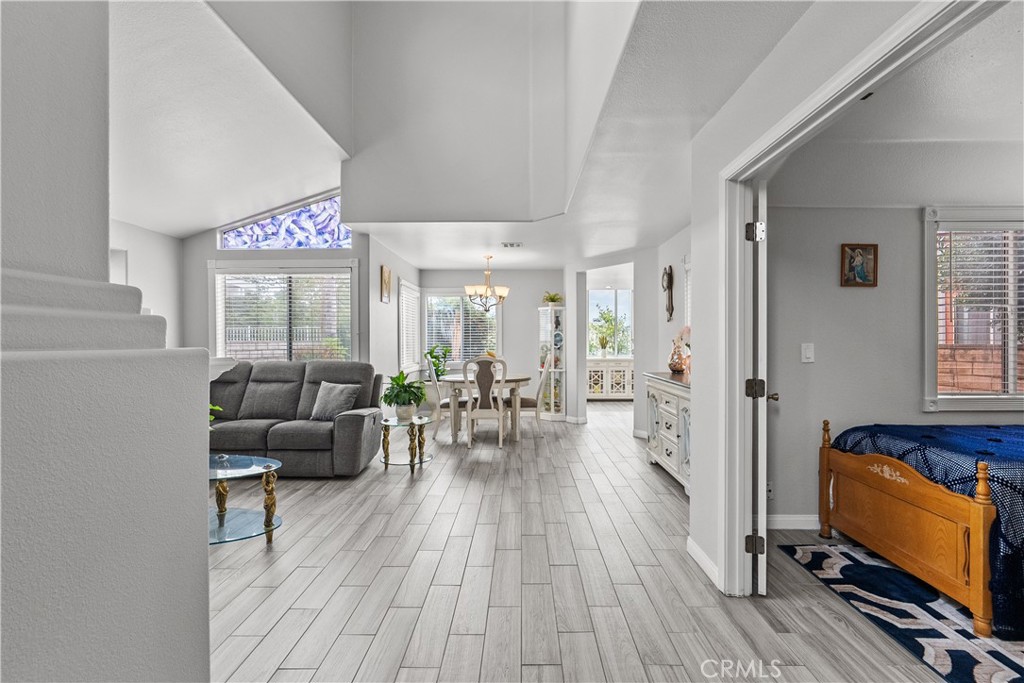 25726 Emerson Lane Stevenson Ranch, CA 91381 - Photo 17 of 45 a living room with furniture and a flat screen tv