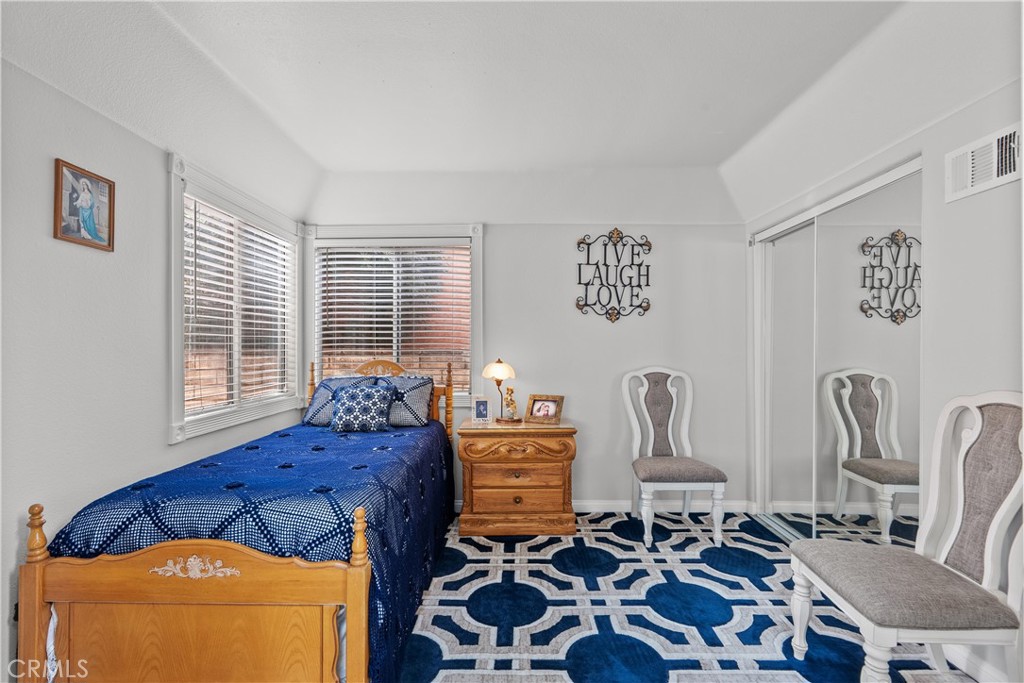 25726 Emerson Lane Stevenson Ranch, CA 91381 - Photo 18 of 45 a bed room with furniture and a window