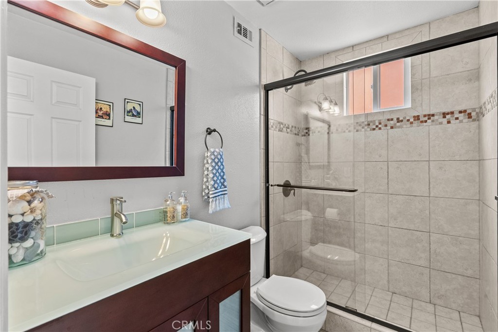 25726 Emerson Lane Stevenson Ranch, CA 91381 - Photo 20 of 45 a bathroom with a sink a toilet and shower