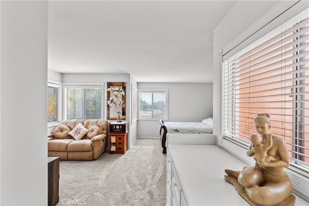 25726 Emerson Lane Stevenson Ranch, CA 91381 - Photo 22 of 45 a living room with furniture and a large window