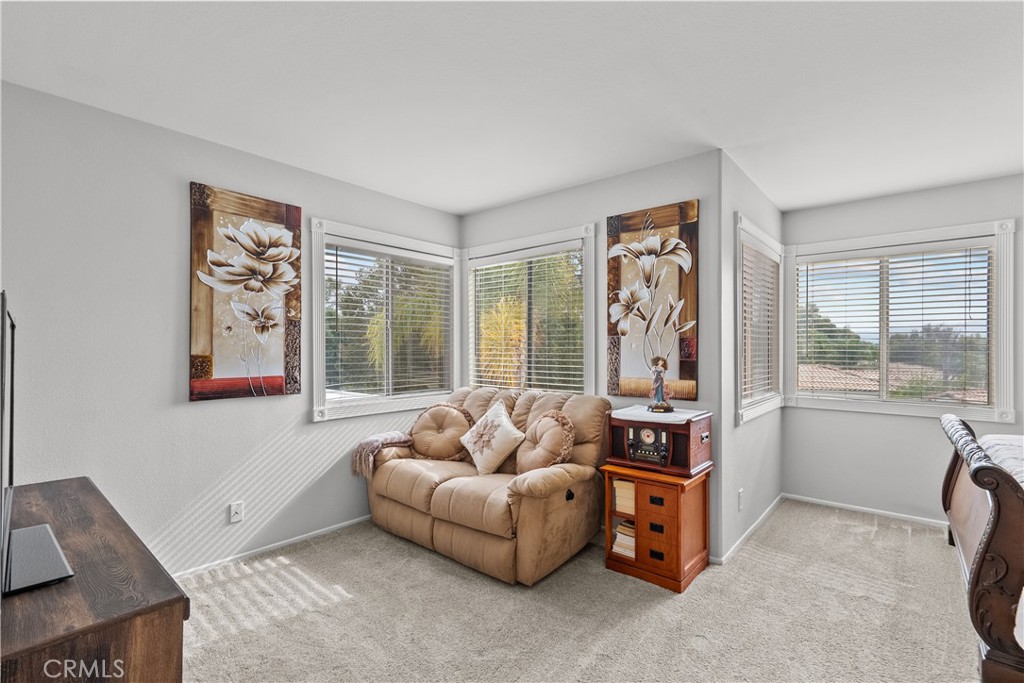 25726 Emerson Lane Stevenson Ranch, CA 91381 - Photo 23 of 45 a living room with furniture and a large window