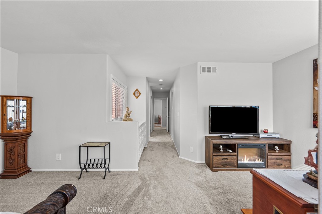 25726 Emerson Lane Stevenson Ranch, CA 91381 - Photo 26 of 45 a view of a workspace with furniture and a window