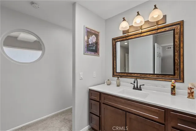 a bathroom with a toilet and a shower curtain