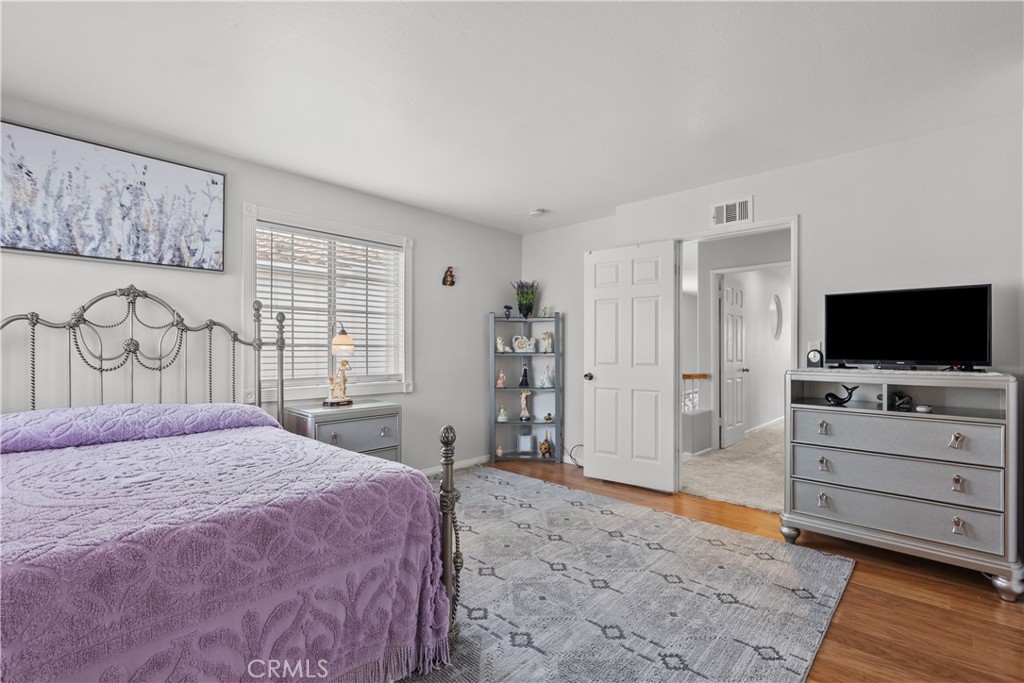 25726 Emerson Lane Stevenson Ranch, CA 91381 - Photo 30 of 45 a bedroom with a bed and a flat screen tv