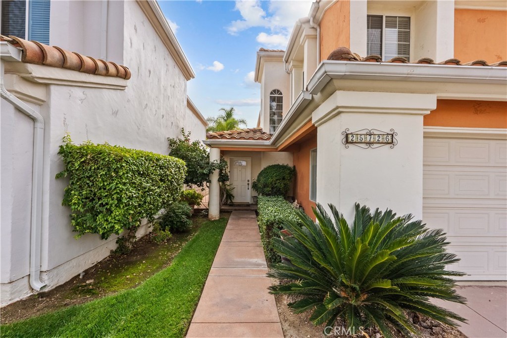 25726 Emerson Lane Stevenson Ranch, CA 91381 - Photo 3 of 45 a front view of a house with garden