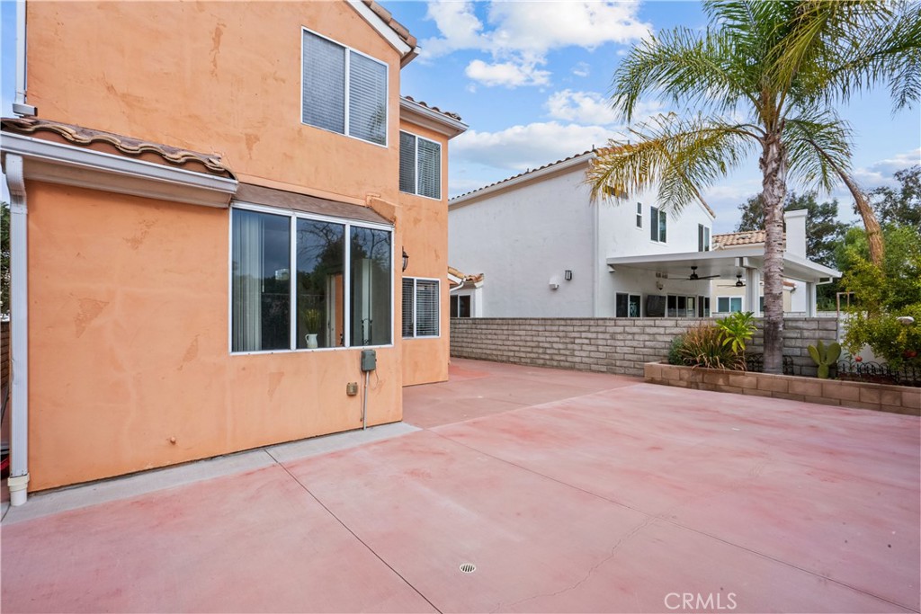 25726 Emerson Lane Stevenson Ranch, CA 91381 - Photo 39 of 45 a view of a white house with a yard