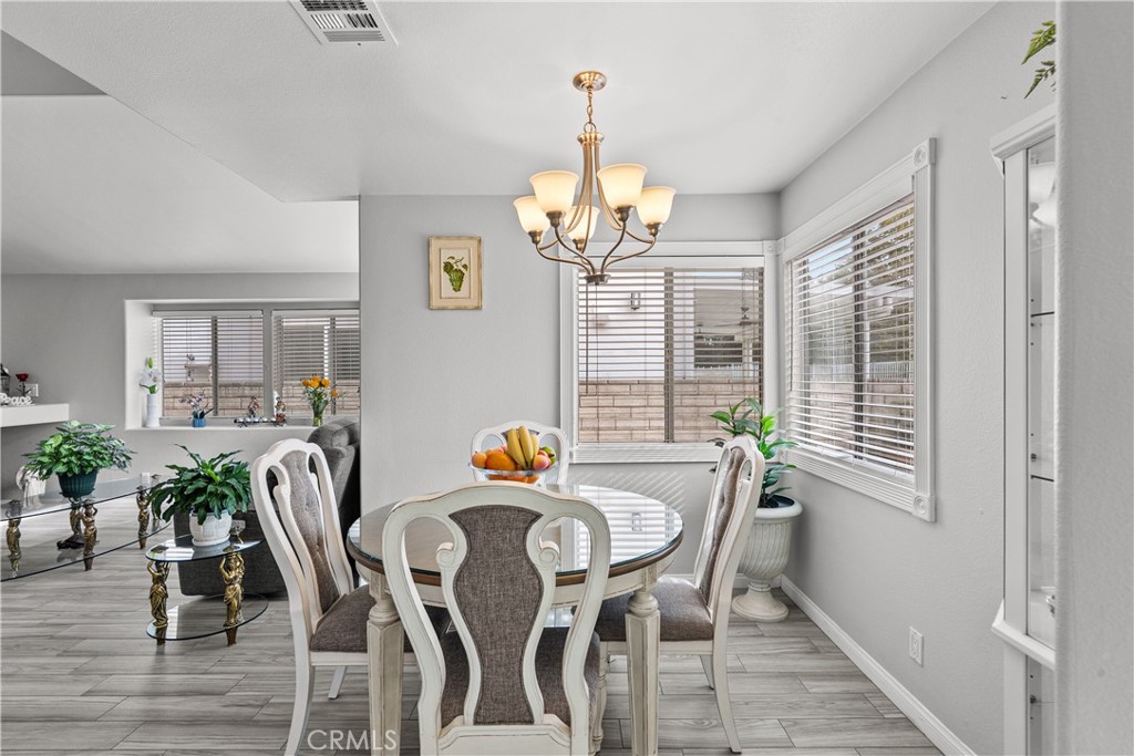 25726 Emerson Lane Stevenson Ranch, CA 91381 - Photo 10 of 45 a view of a dining room with furniture and window
