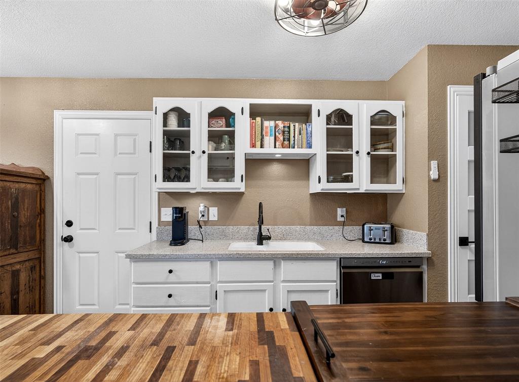 1006 Oakchase Court Azle, TX 76020 - Photo 4 of 19 a spacious bathroom with a granite countertop sink and a window