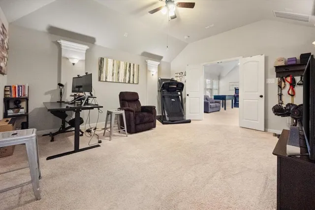 a view of a livingroom with furniture and a flat screen tv