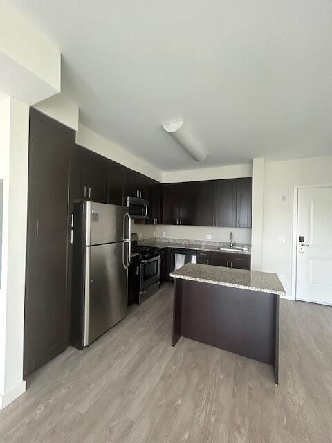 120 A Towne Street, Unit 237 Stamford, CT 06902 - Photo 12 of 20 a kitchen with stainless steel appliances a refrigerator and a stove