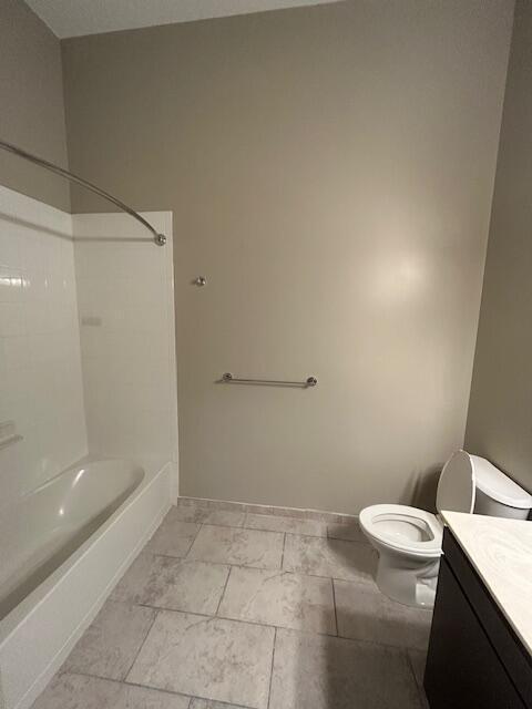 120 A Towne Street, Unit 237 Stamford, CT 06902 - Photo 16 of 20 a bathroom with a granite countertop toilet and a shower