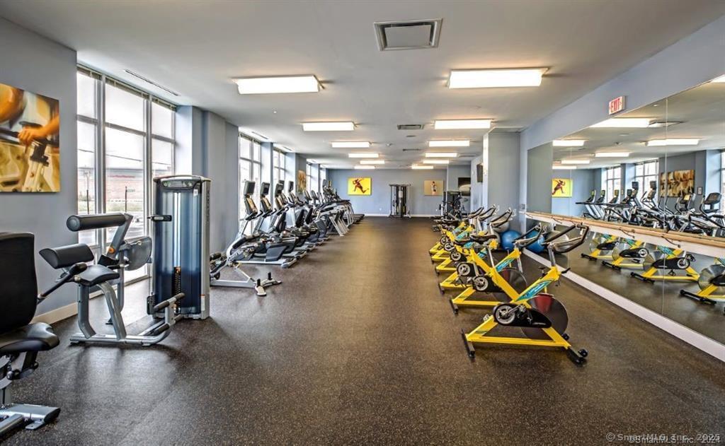 120 A Towne Street, Unit 237 Stamford, CT 06902 - Photo 6 of 20 a view of a room with gym equipment