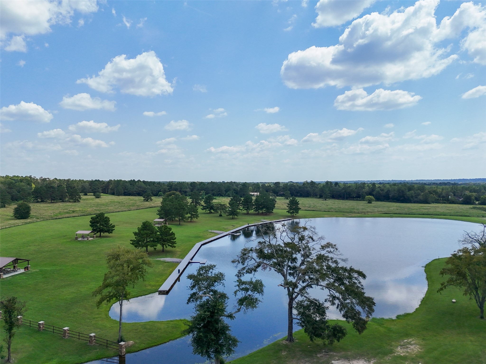 11709 Grand N Road Willis, TX 77378 - Photo 34 of 37 Gorgeous 37-acre park welcomes you at the entrance of the community, complete with a 7-acre fishing lake, hiking trails, a fitness trail, and pavilions for gathering.