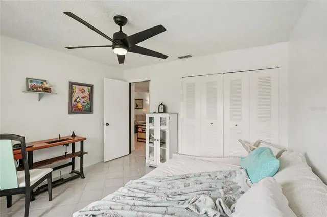 a bedroom with a bed and a dresser