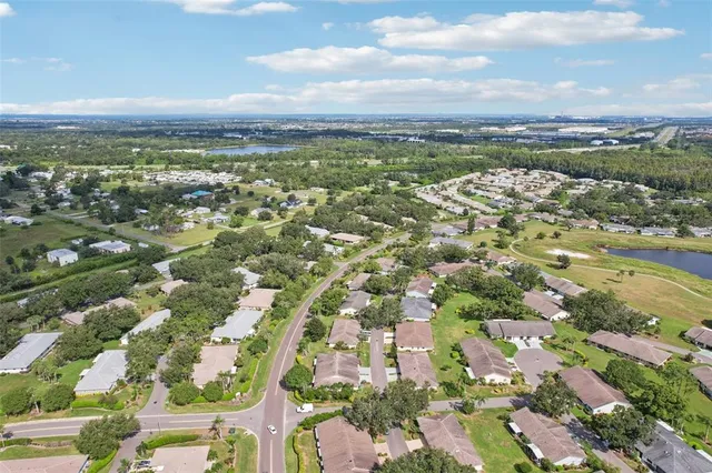 an aerial view of city and lake