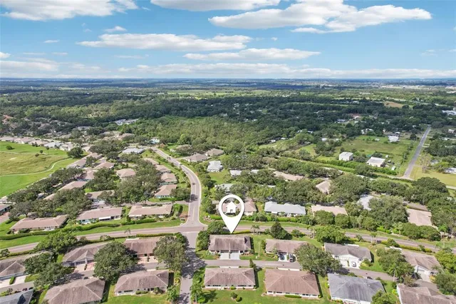 an aerial view of residential building with parking space