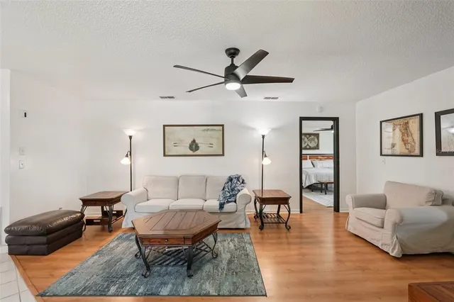 a living room with furniture and a rug