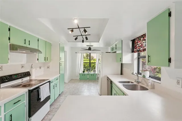 a kitchen that has a lot of cabinets in it