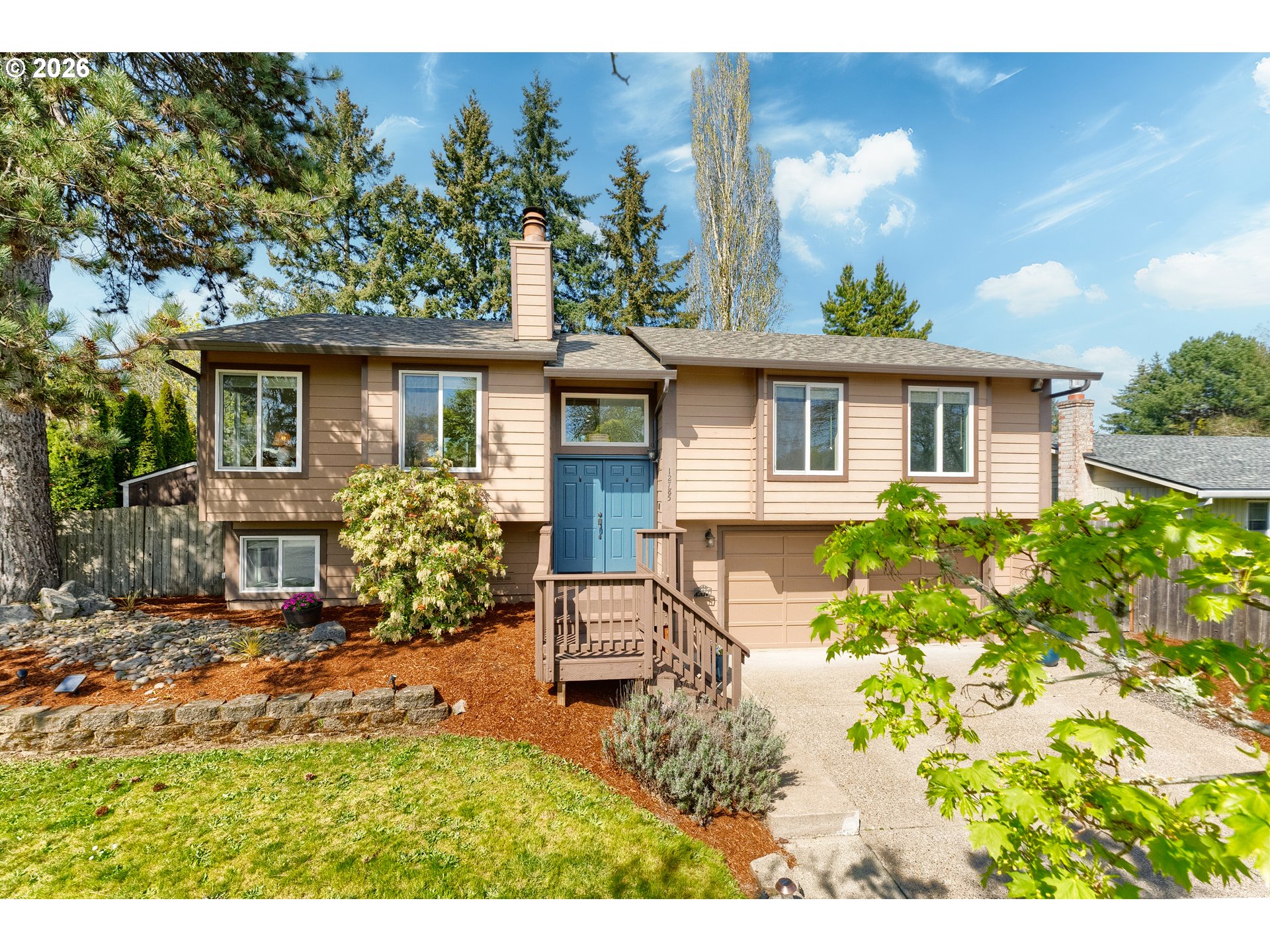 12785 Southwest Percheron Lane Beaverton, OR 97008 - Photo 2 of 42 a house view with a garden space